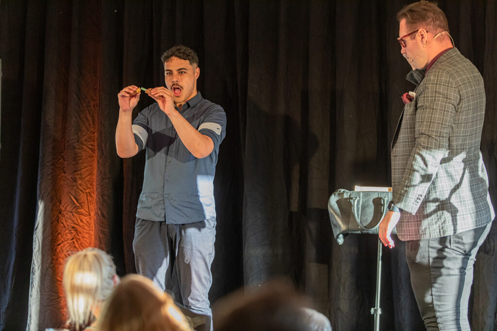Brendan Dooley Comedy Magician on stage with volunteer