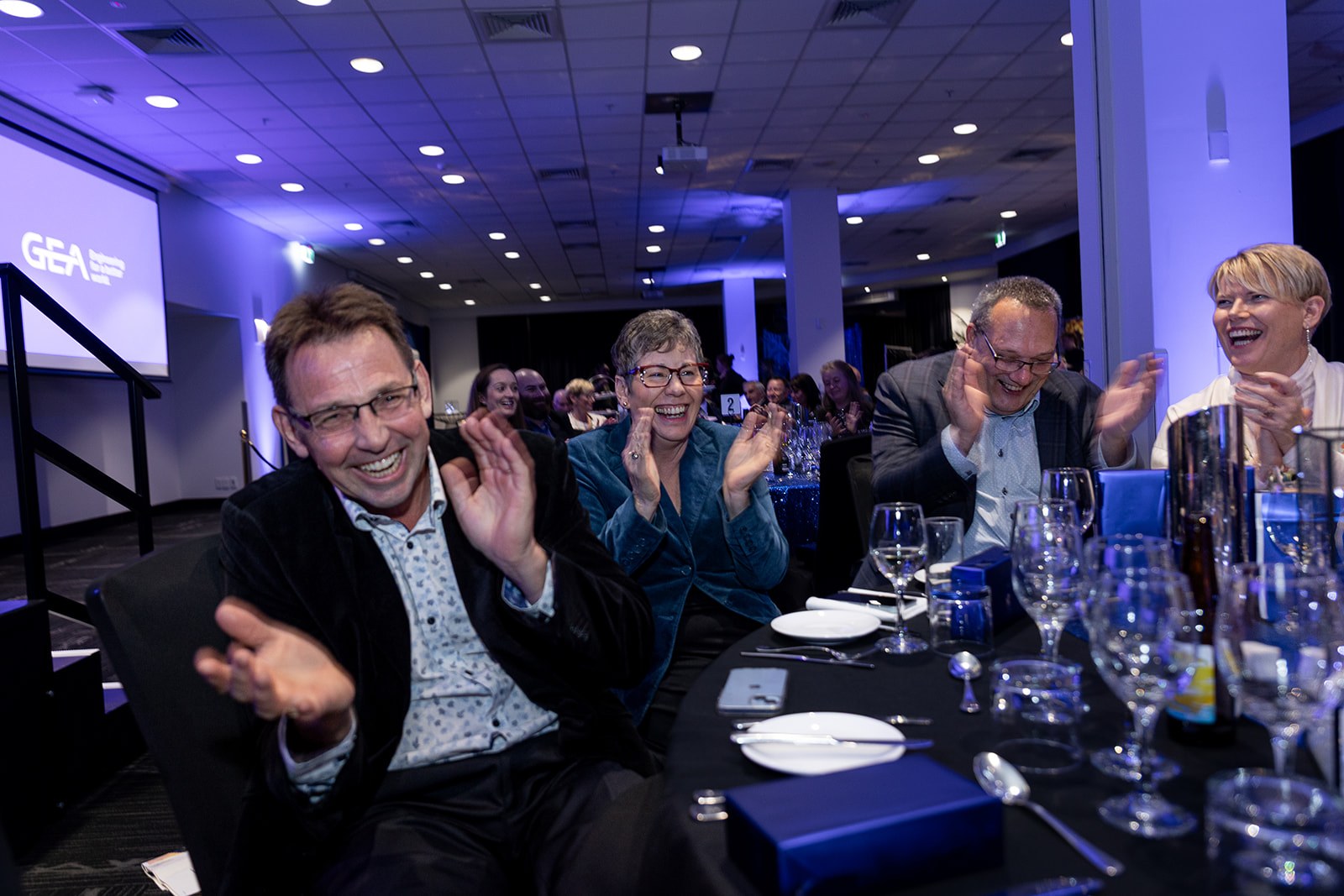 Audience members laughing at the performance Brendan Dooley Comedy Magician in NZ