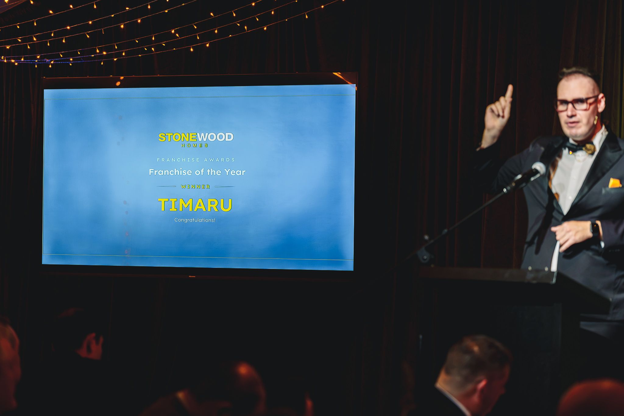 Brendan Dooley announcing the Franchise of the Year award at the Stonewood Homes gala in Queenstown